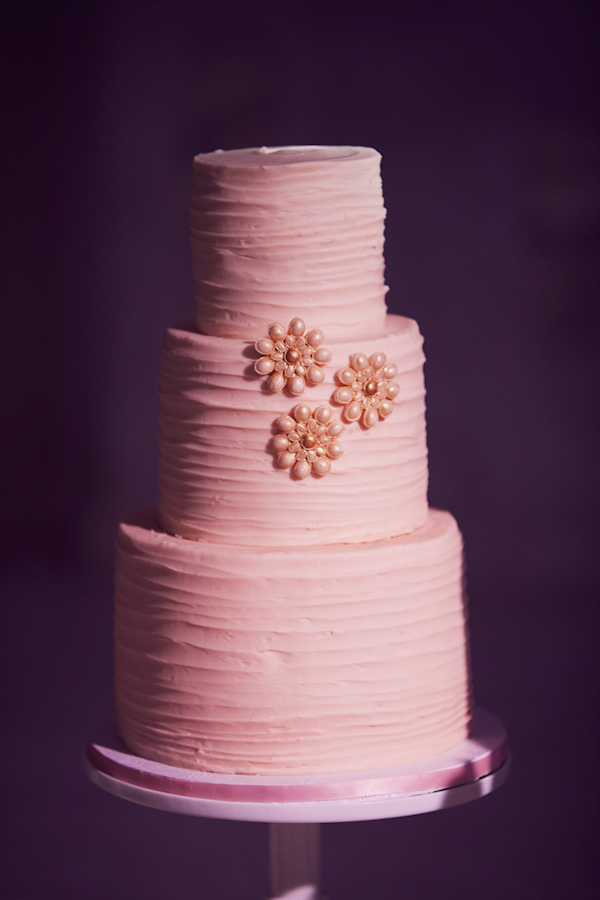 Pink three tiered weddig cake with pink flower decorations for Armenian